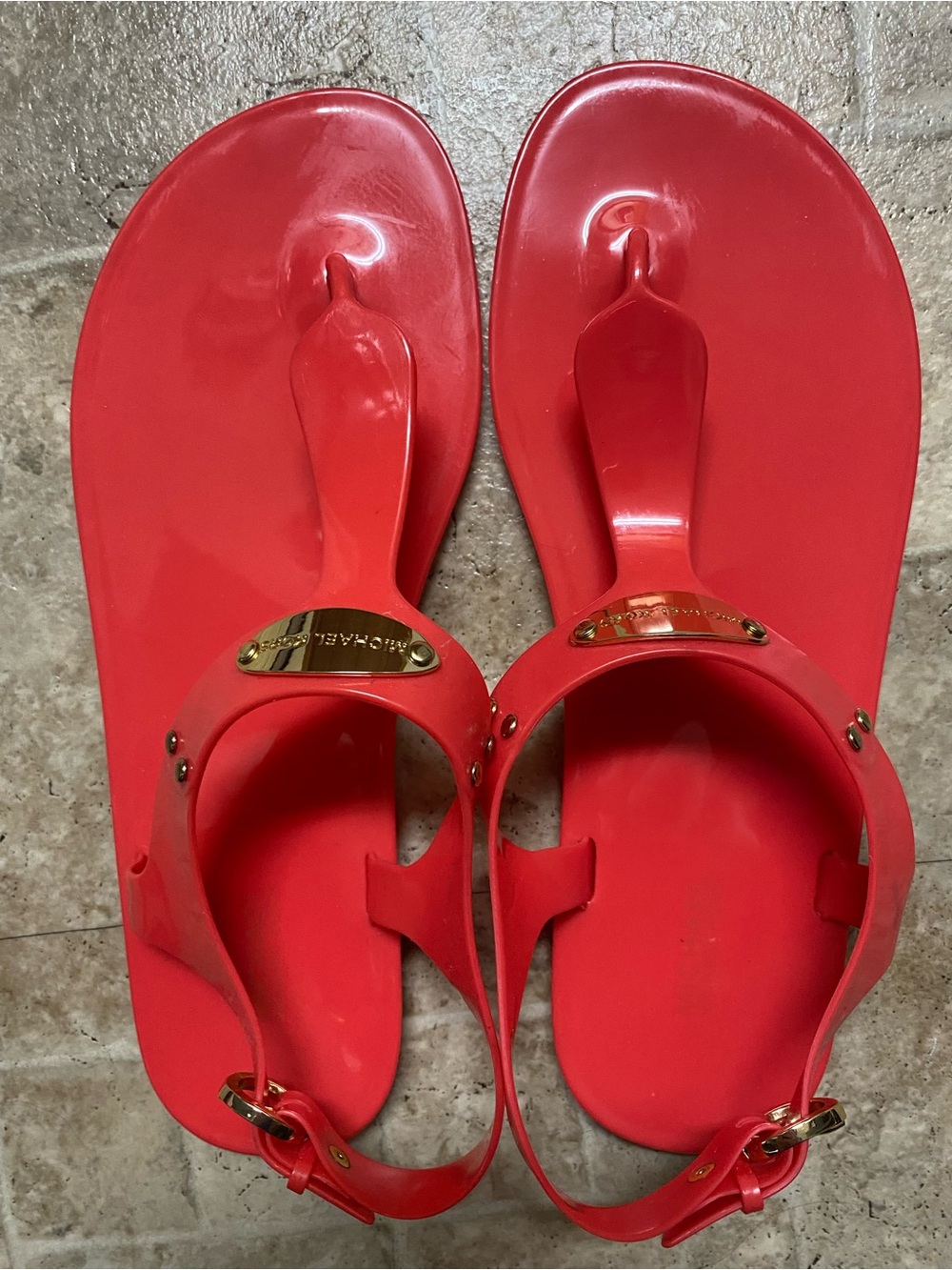 Michael Kors Bright Coral Jelly Sandals with Gold Plaque